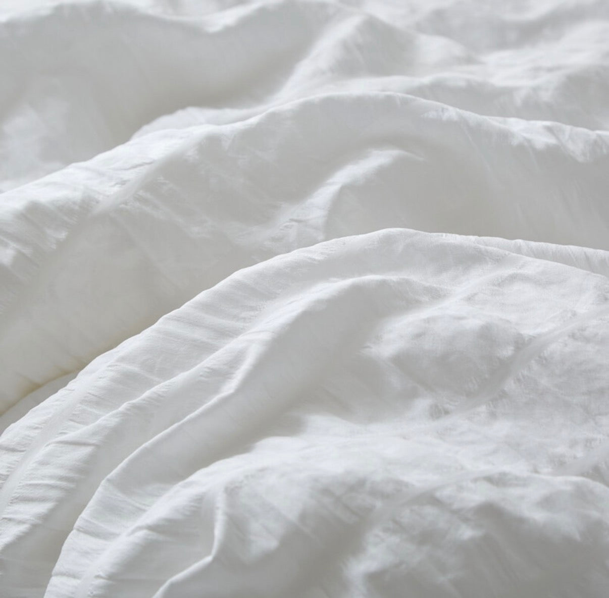Parure de lit texturée
Seersucker blanc housse de couette, taie d’oreiller